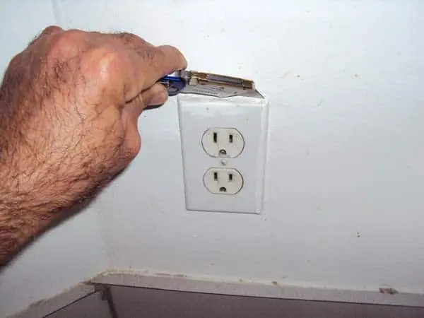 Cutting around painted wall outlet plate to remove without damaging wall